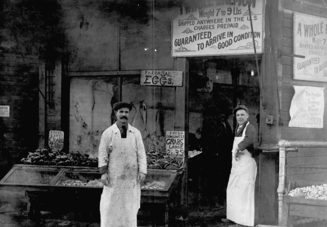 Solomon Calvo, left, a Sephardic Jewish merchant, and Fred August are at Western Fish and Oyster Co., circa 1918. Calvo was one of the first Sephardic Jews to arrive in Seattle.  (Washington State Jewish Historical Society/University of Washington Special Collections)