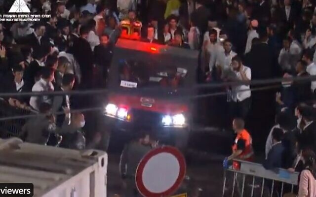 An ambulence tries to navigate through the crowd at Mount Meron in northern Israel on April 30, 2021 after a stand collapsed wounding dozends (Screencapture/Twitter)