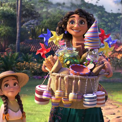 This image released by Disney shows Mirabel, voiced by Stephanie Beatriz, in a scene from the animated film "Encanto." (Disney via AP)
