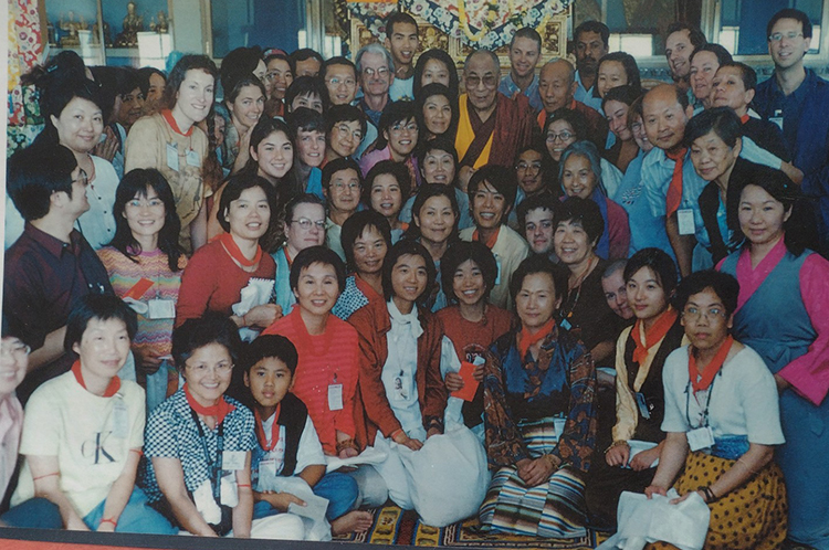 Land of Compassion Buddha Group meeting with H.H. The Dalai Lama in the Ganden Monastery, Mundgod, India, December 2001. Mimi Pollack is second from the left in the third row. (Photo: Courtesy of Mimi Pollack)