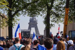 Political rally in front of Eiffel Tower in Paris, March 27, 2022. Credit: Spech/Shutterstock.